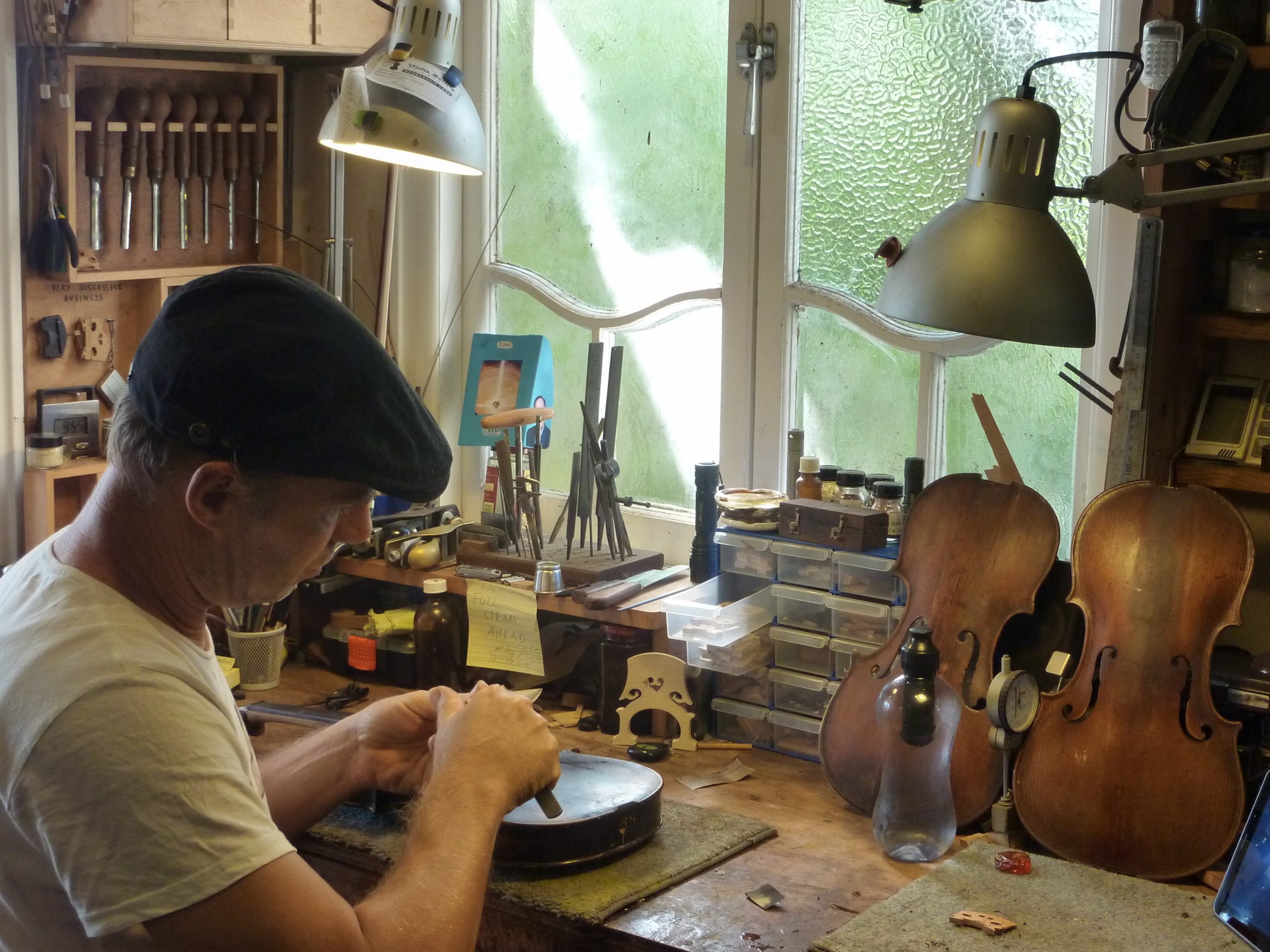 Master violin maker Olaf Grawert repairing a violin in Brisbane