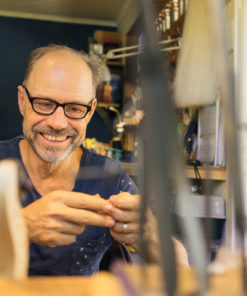 Master violin maker Olaf Grawert repairing a violin in Brisbane